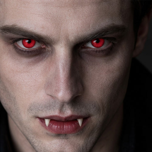 Man in vampire makeup wearing red Halloween contact lenses